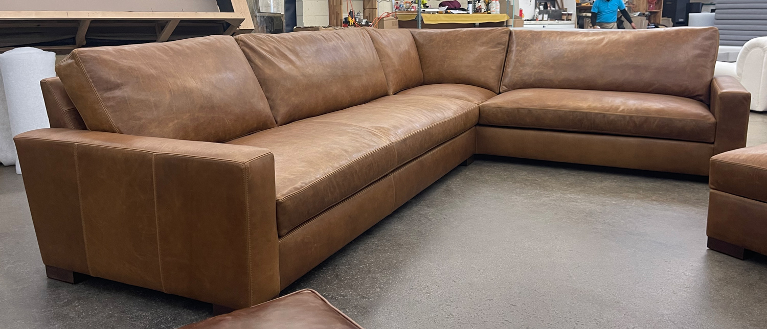 Custom Braxton L Sectional in Berkshire Tan Leather with matching Storage Ottoman - LAF front angle