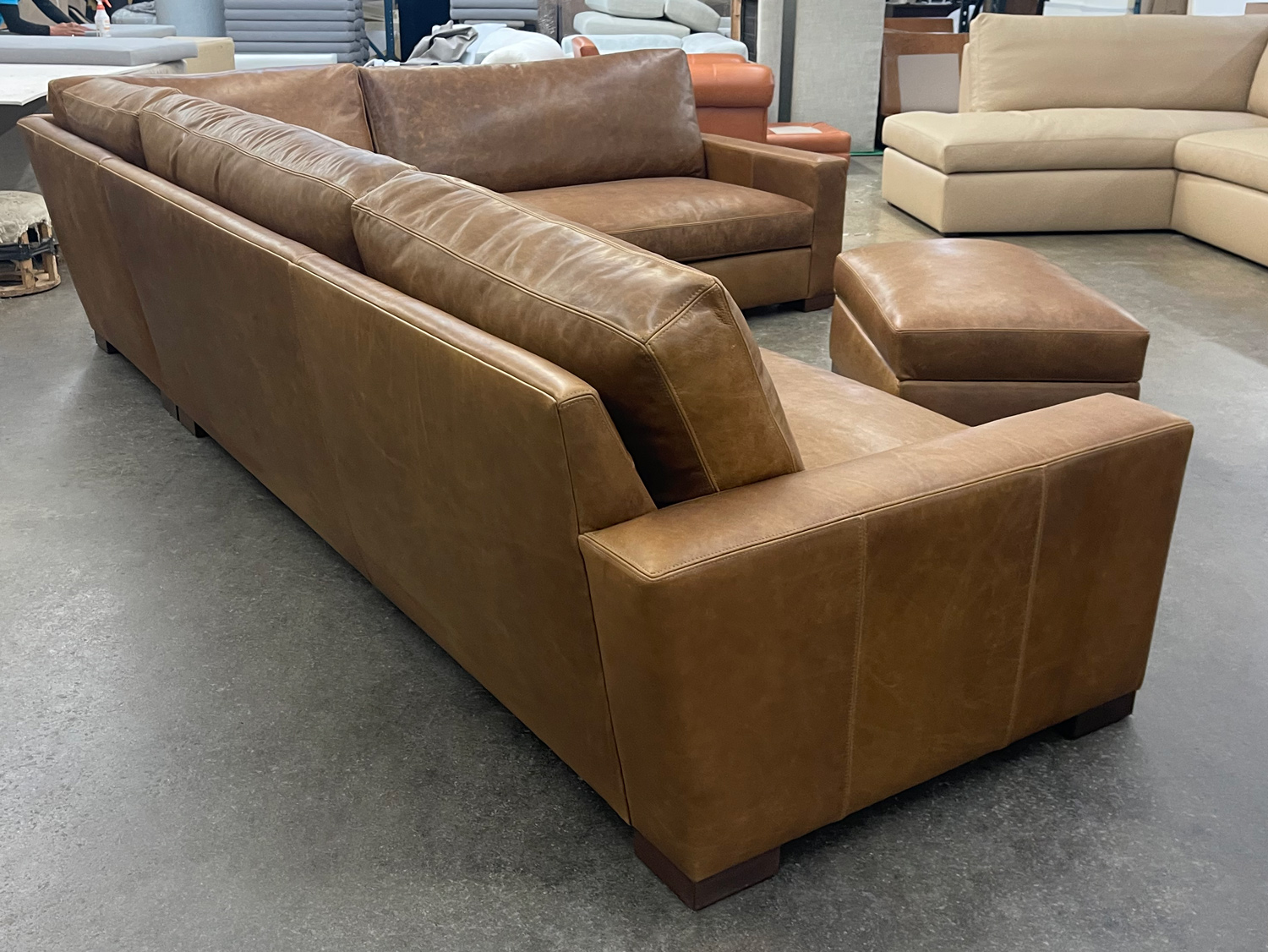 Custom Braxton L Sectional in Berkshire Tan Leather with matching Storage Ottoman - LAF rear angle