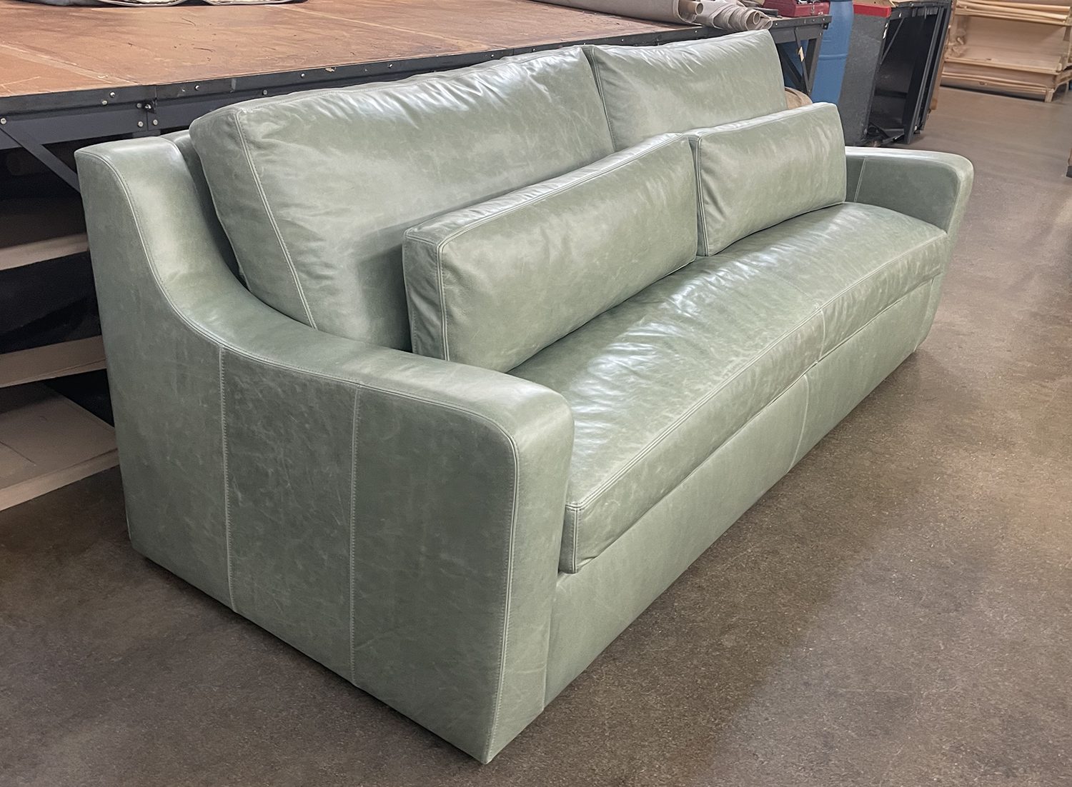 Julien Slope Arm Sofa in Mont Blanc Seaglass leather - RAF front angle view