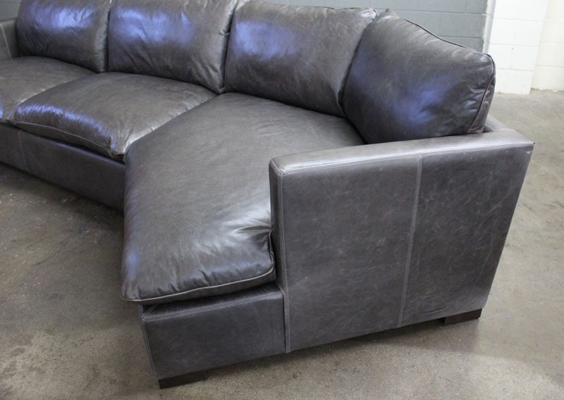 Detail view of the Cuddler on our Reno Leather Sectional Sofa in Mont Blanc Wolf