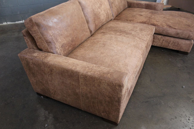 Front angle detail view of Braxton Sofa Chaise Sectional in Italian Destroyed Leather, Ragtime Natural