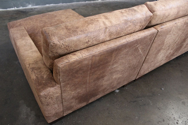 Back detail view of Braxton Sofa Chaise Sectional in Italian Destroyed Leather, Ragtime Natural