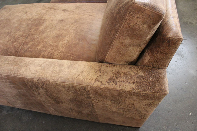 Side detail view of Braxton Sofa Chaise Sectional in Italian Destroyed Leather, Ragtime Natural