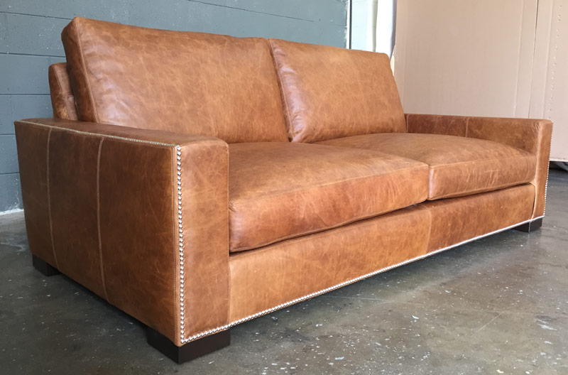 Italian Berkshire Leather on our Braxton Leather Sofa with Nail head trim