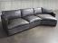 Upper front side view of the Reno Leather Sectional Sofa with Cuddler in Mont Blanc Timberwolf