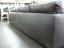Rear angle of The Dexter Leather Grand Sofa shown in Glove Timberwolf - Silver Gray